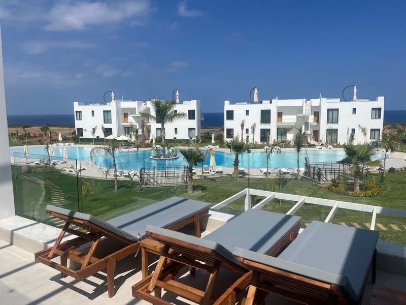 2 bedroom luxury Seafront garden apartment + communal swimming pools + within a perfect holiday complex with many amenities